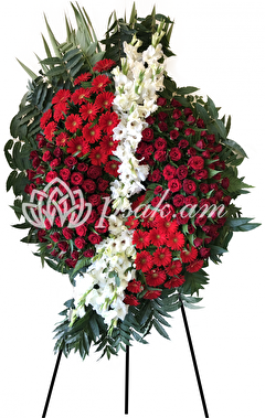 Condolence wreath of red and white flowers
